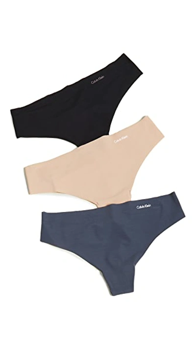 Calvin Klein Underwear Invisibles Thong 3 Pack In Speakeasy/light Caramel/black
