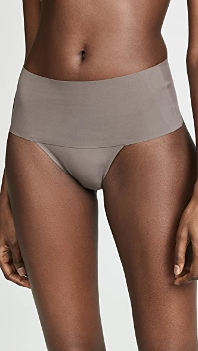 Shop Spanx Undie-tectable Thong In Umber Ash