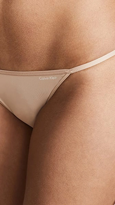 Shop Calvin Klein Underwear Sleek String Bikini Panties In Bare