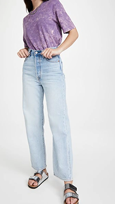 Levi's Ribcage High Waisted Flares In Light Wash Blue In Middle Road