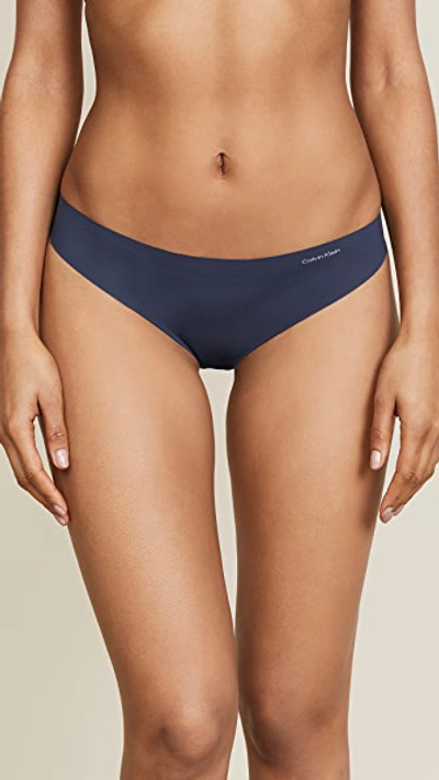 Shop Calvin Klein Underwear Invisibles Thong In Speakeasy