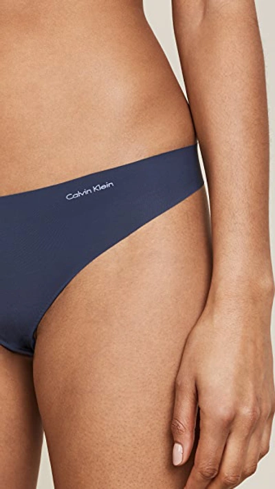 Shop Calvin Klein Underwear Invisibles Thong In Speakeasy
