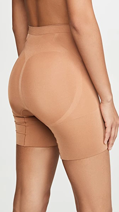 Shop Spanx Oncore Mid Thigh Shorts In Naked 3.0