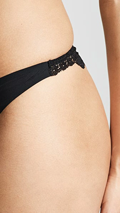 Shop Stella Mccartney Smooth & Lace Thong In Black