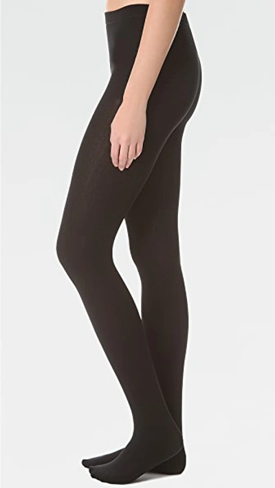 Shop Plush Fleece Lined Tights In Black