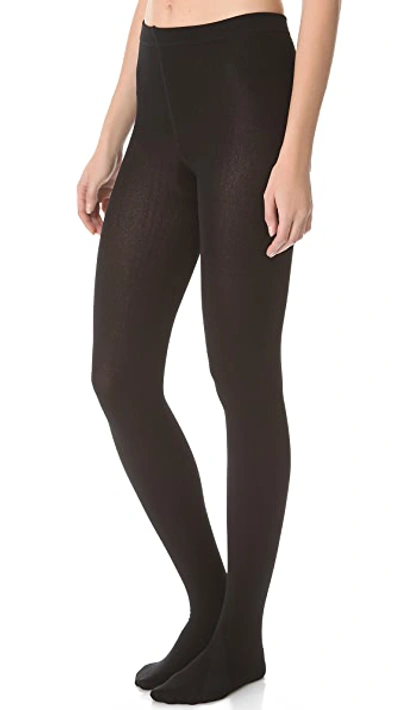 Shop Plush Fleece Lined Tights In Black