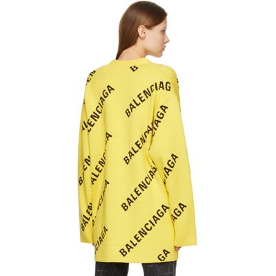 Shop Balenciaga Yellow Allover Logo Cardigan In 7440 Yellow/black