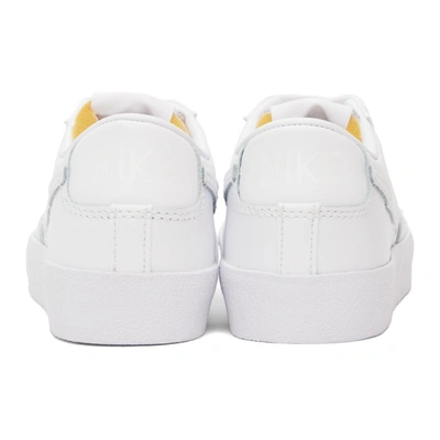 Shop Nike White Blazer Low '77 Sneakers In White/white-white-wh