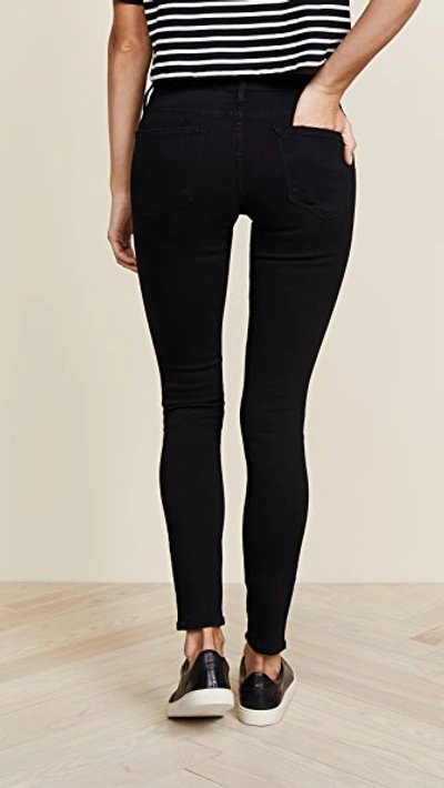 Shop Frame Le Color Rip Skinny Jeans In Film Noir