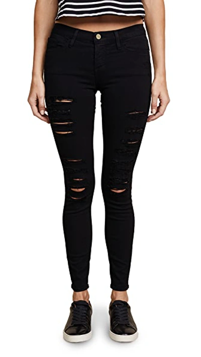 Shop Frame Le Color Rip Skinny Jeans In Film Noir