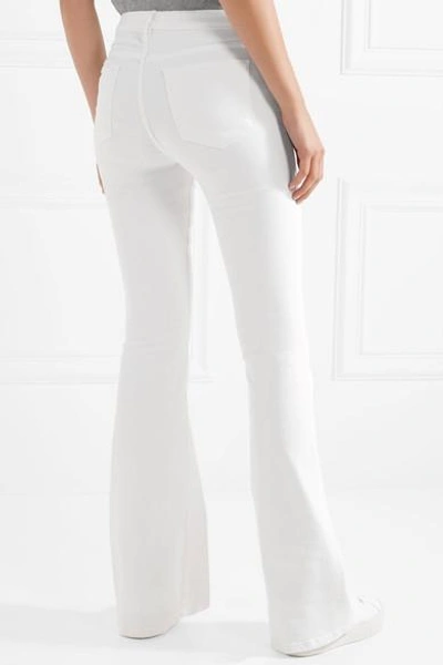 Shop Frame Le High Flare Jeans In White