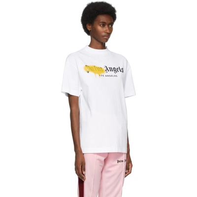 Shop Palm Angels White 'los Angeles' Sprayed Logo T-shirt In White Yellow