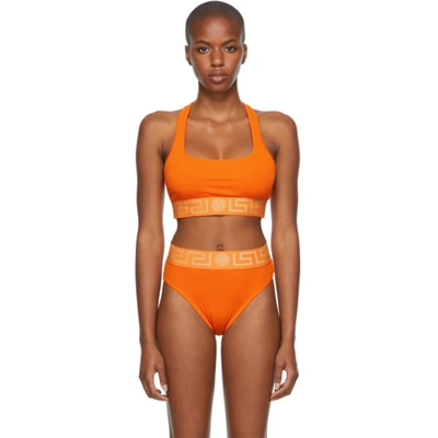 Versace Orange Greca Border Sports Bra In 1o340 Orange Gold