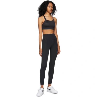 Shop Nike Black Swoosh Luxe Sports Bra In 010 Black/dk Smoke