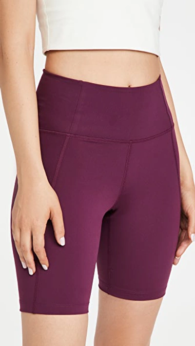 Shop Girlfriend Collective High Rise Bike Shorts In Plum