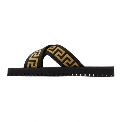 Shop Versace Black & Gold Nastro Greca Cross Strap Sandals In D4dov Black/brown
