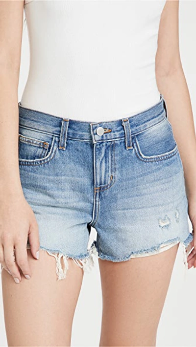 Shop L Agence Audrey Mid Rise Denim Shorts In Westport