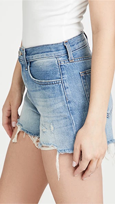 Shop L Agence Audrey Mid Rise Denim Shorts In Westport