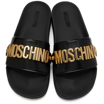 Shop Moschino Black & Gold Logo Lettering Pool Slides In 000 Nero