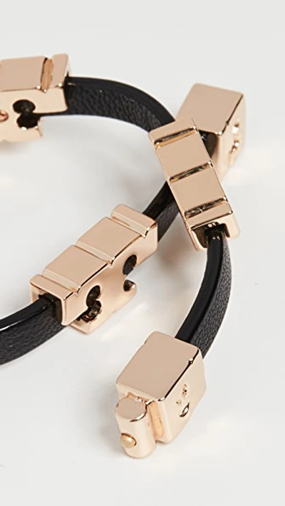 Shop Tory Burch Serif-t Stackable Bracelet In Tory Gold/black/black