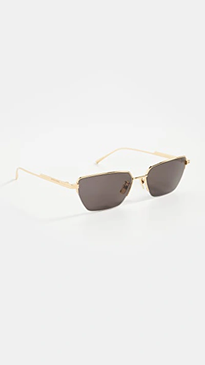 Shop Bottega Veneta Narrow Metal Cat Eye Sunglasses In Gold-gold-grey