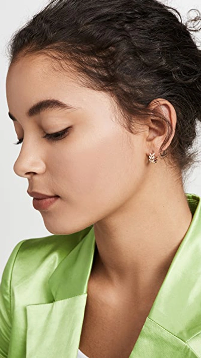 Shop Shashi Amelia Huggie Earrings In Gold