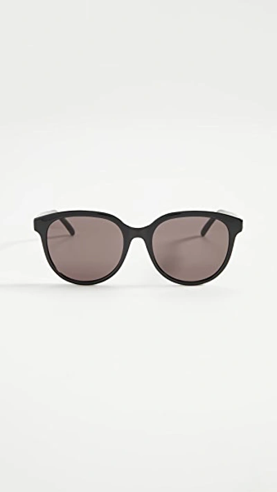 Shop Saint Laurent Signature Round Sunglasses In Black/black/black