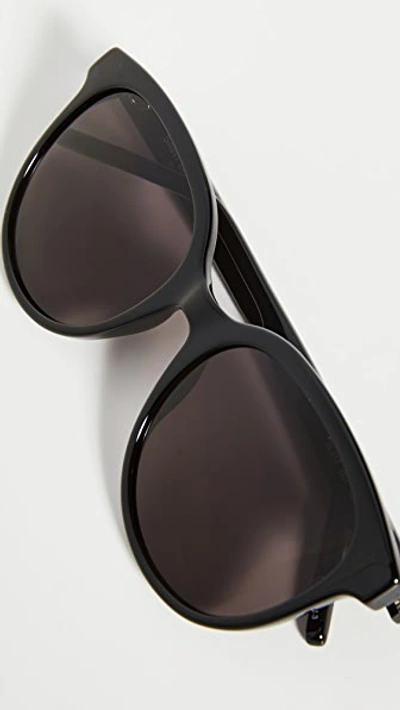 Shop Saint Laurent Signature Round Sunglasses In Black/black/black