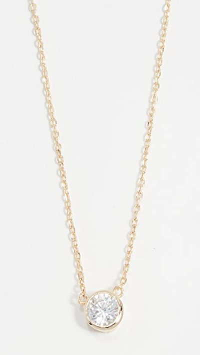 Shop Shashi Solitaire Necklace In Gold/clear