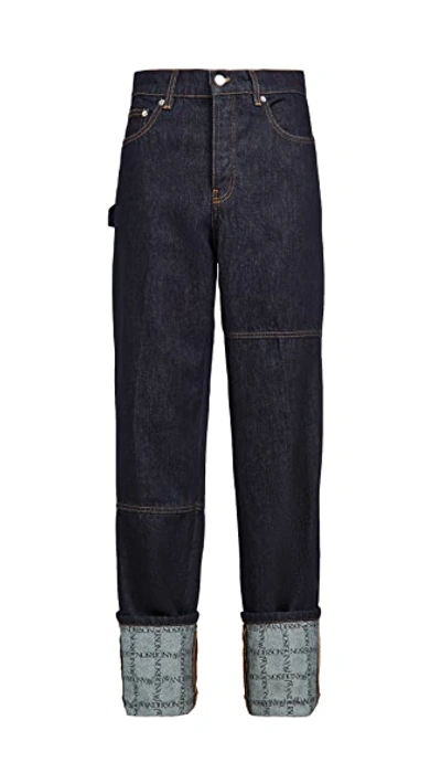 Shop Jw Anderson Logo Grid Turn Up Workwear Jeans In Indigo