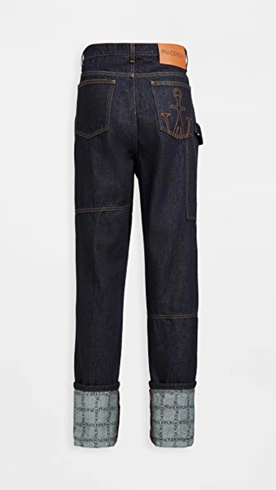 Shop Jw Anderson Logo Grid Turn Up Workwear Jeans In Indigo