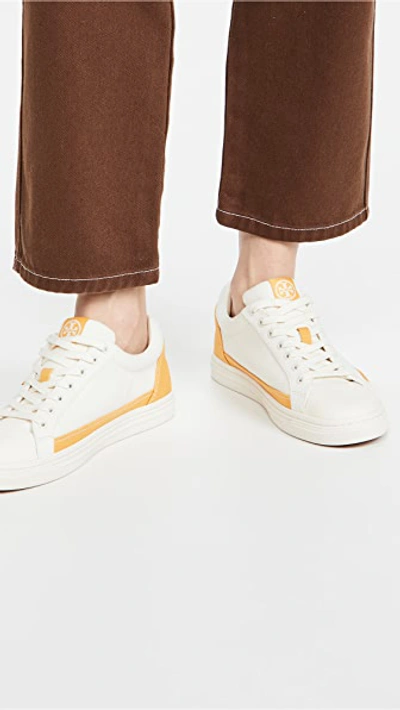 Shop Tory Burch Classic Court Sneakers In Ivory/curry Yellow
