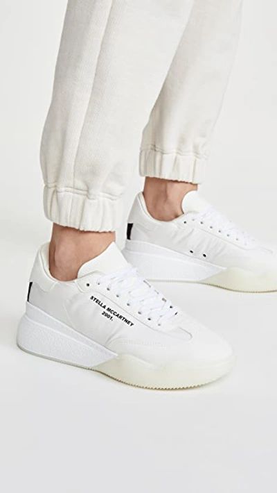 Shop Stella Mccartney Runner Loop Sneakers In White/black