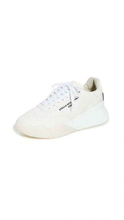 Shop Stella Mccartney Runner Loop Sneakers In White/black