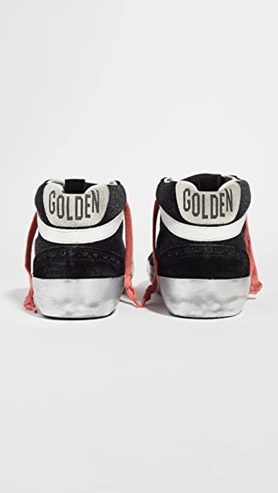 Shop Golden Goose Mid Star Sneakers Black/white