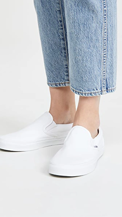 Shop Vans Ua Classic Slip On Sneakers True White