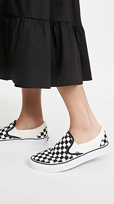 Shop Vans Ua Classic Slip-on Sneakers Black & White Checkerboard