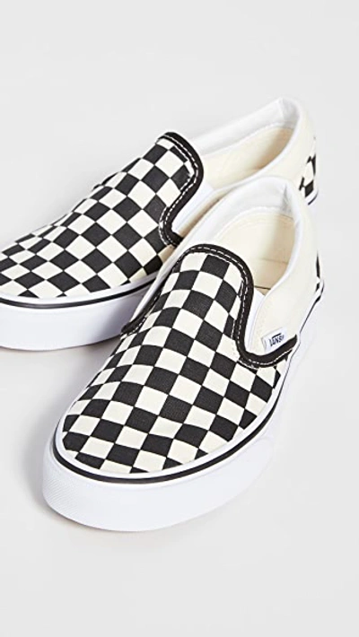 Shop Vans Ua Classic Slip-on Sneakers Black & White Checkerboard