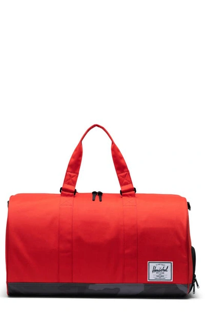 Shop Herschel Supply Co Novel Duffle Bag In Fiery Red/ Night Camo