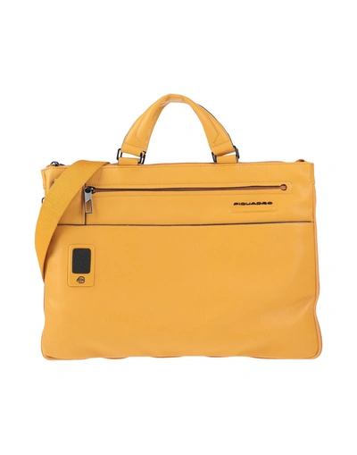 Shop Piquadro Handbags In Ocher