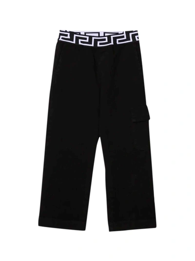 Shop Versace Black Trousers With Greca Print Kids In Nero/bianco