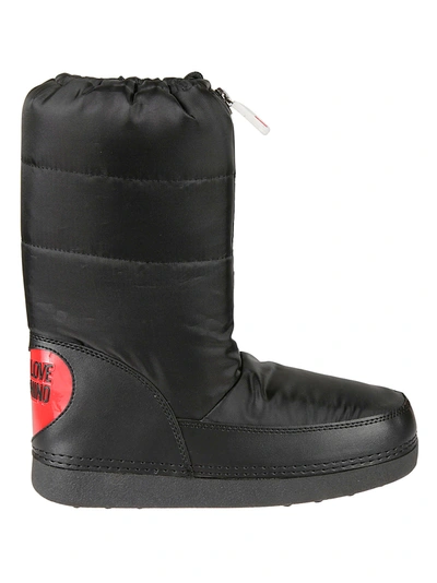Shop Love Moschino Embossed Logo Padded Boots In Black