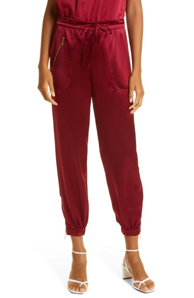 Shop Milly Rylan Hammered Satin Joggers In Wine