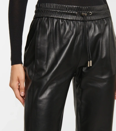 Shop Saint Laurent Zip-cuff Leather Sweatpants In Black