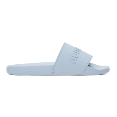 Shop Burberry Embossed Logo Slides In Pale Blue