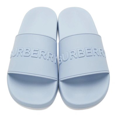 Shop Burberry Embossed Logo Slides In Pale Blue