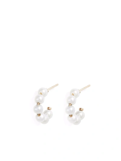 Shop Poppy Finch 14kt Yellow Gold Mini Baby Pearl Huggie Earrings In 金色