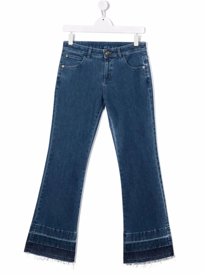 Shop Versace Low-rise Flared Denim Jeans In 蓝色