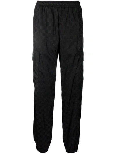 Shop Misbhv Monogram-print Trousers In 黑色