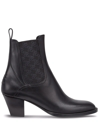 Shop Fendi Tronchetto Ankle Boots In Black